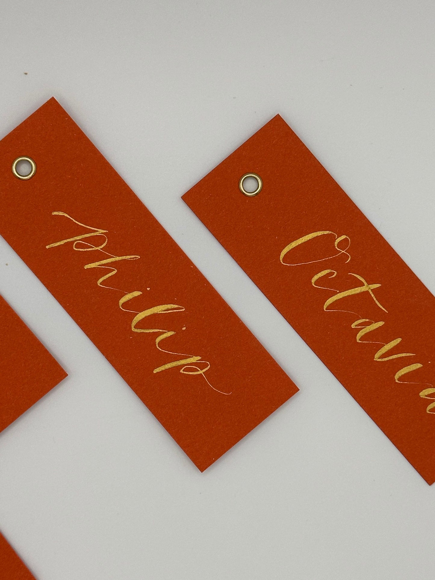OCHRE Calligraphy Place Name Card | Matte Coloured Card with Hand Written Calligraphy optional gold or silver eyelet
