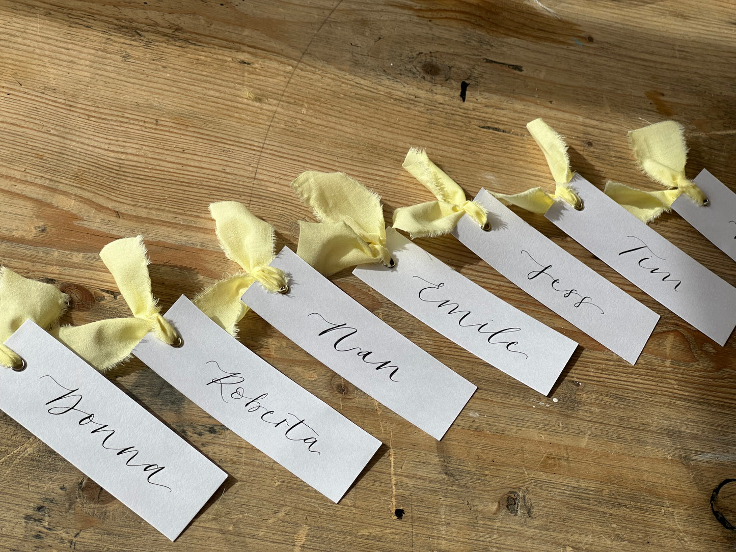 BUTTER Linen Calligraphy Place Name Card | White Calligraphy Wedding Place Name Card | Gold or Silver Eyelet