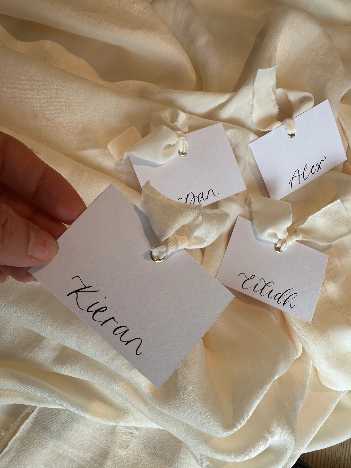 Square *ish Ribbon Calligraphy Place Name Card | White Calligraphy Wedding Place Name Card | Gold or Silver Eyelet Place Card