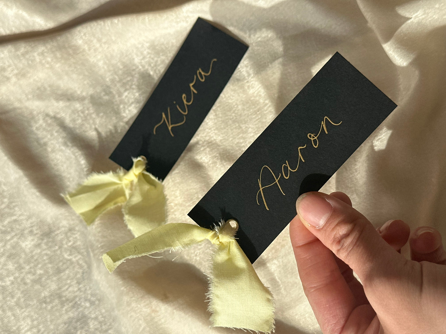 BLACK + BUTTER Linen Ribbon Calligraphy Place Name Card | Black Calligraphy Wedding Place Name Card | Gold or Silver Eyelet