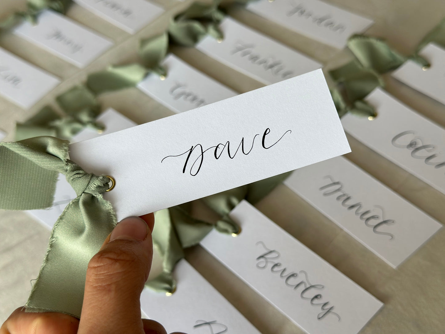 SAGE GREEN Satin Ribbon Calligraphy Place Name Card | White Calligraphy Wedding Place Name Card | Gold or Silver Eyelet