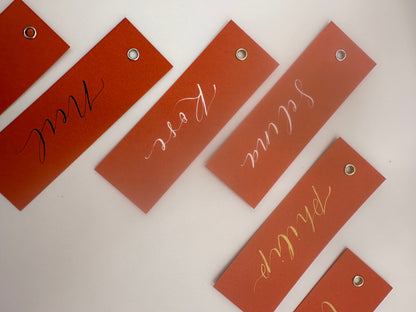 OCHRE Calligraphy Place Name Card | Matte Coloured Card with Hand Written Calligraphy optional gold or silver eyelet