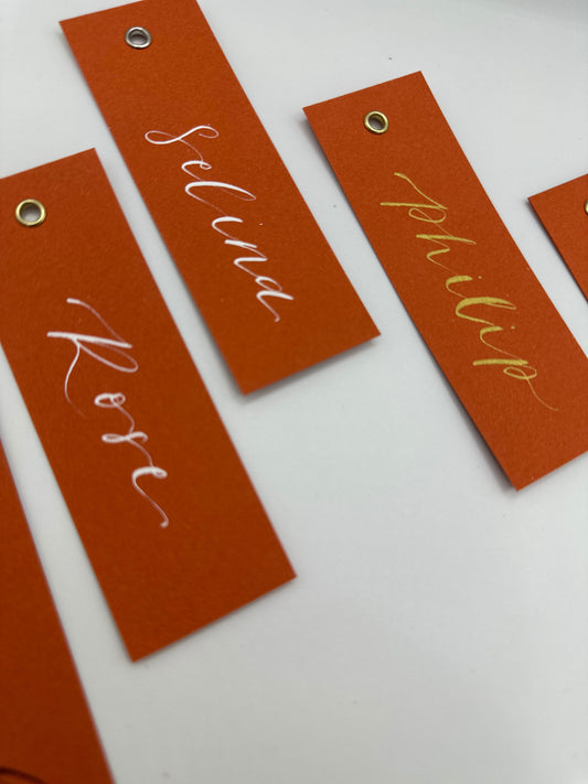 OCHRE Calligraphy Place Name Card | Matte Coloured Card with Hand Written Calligraphy optional gold or silver eyelet