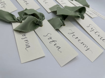 ivory wedding place card, elegant place cards, customizable wedding place cards, luxurious place card, ivory and gold wedding decor, elegant wedding stationery, personalized wedding reception, chic table decorations, classic wedding place setting, sophisticated wedding details