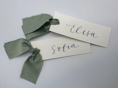 ivory wedding place card, elegant place cards, customizable wedding place cards, luxurious place card, ivory and gold wedding decor, elegant wedding stationery, personalized wedding reception, chic table decorations, classic wedding place setting, sophisticated wedding details