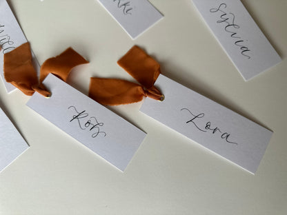OCHRE Chiffon Ribbon Calligraphy Place Name Card | White Calligraphy Wedding Place Name Card | Gold or Silver Eyelet