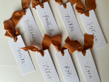 OCHRE Chiffon Ribbon Calligraphy Place Name Card | White Calligraphy Wedding Place Name Card | Gold or Silver Eyelet