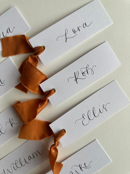 OCHRE Chiffon Ribbon Calligraphy Place Name Card | White Calligraphy Wedding Place Name Card | Gold or Silver Eyelet