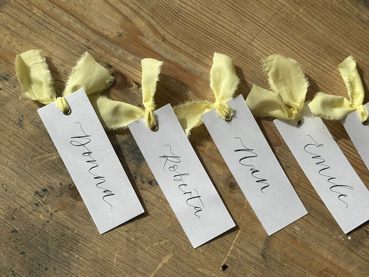 BUTTER Linen Calligraphy Place Name Card | White Calligraphy Wedding Place Name Card | Gold or Silver Eyelet