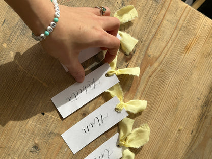 BUTTER Linen Calligraphy Place Name Card | White Calligraphy Wedding Place Name Card | Gold or Silver Eyelet