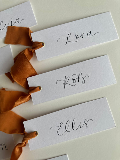 OCHRE Chiffon Ribbon Calligraphy Place Name Card | White Calligraphy Wedding Place Name Card | Gold or Silver Eyelet