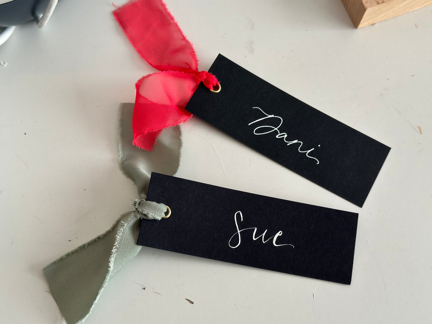 BLACK Ribbon Calligraphy Place Name Card | White Calligraphy Wedding Place Name Card | Gold or Silver Eyelet Place Card