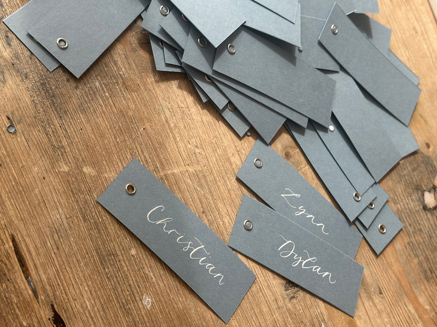 Dusky Blue Calligraphy Place Cards with Eyelet | DIY Add Your Own Ribbon Place Card