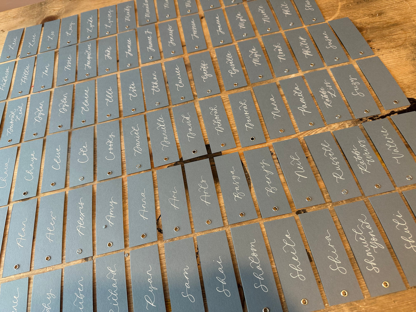Dusky Blue Calligraphy Place Cards with Eyelet | DIY Add Your Own Ribbon Place Card