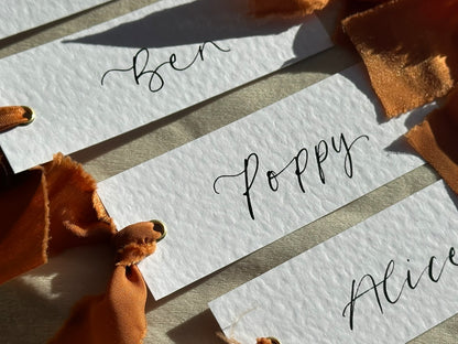 HAMMERED White + OCHRE Chiffon Ribbon Calligraphy Place Name Card | Calligraphy Wedding Place Name Card | Gold or Silver Eyelet Place Card