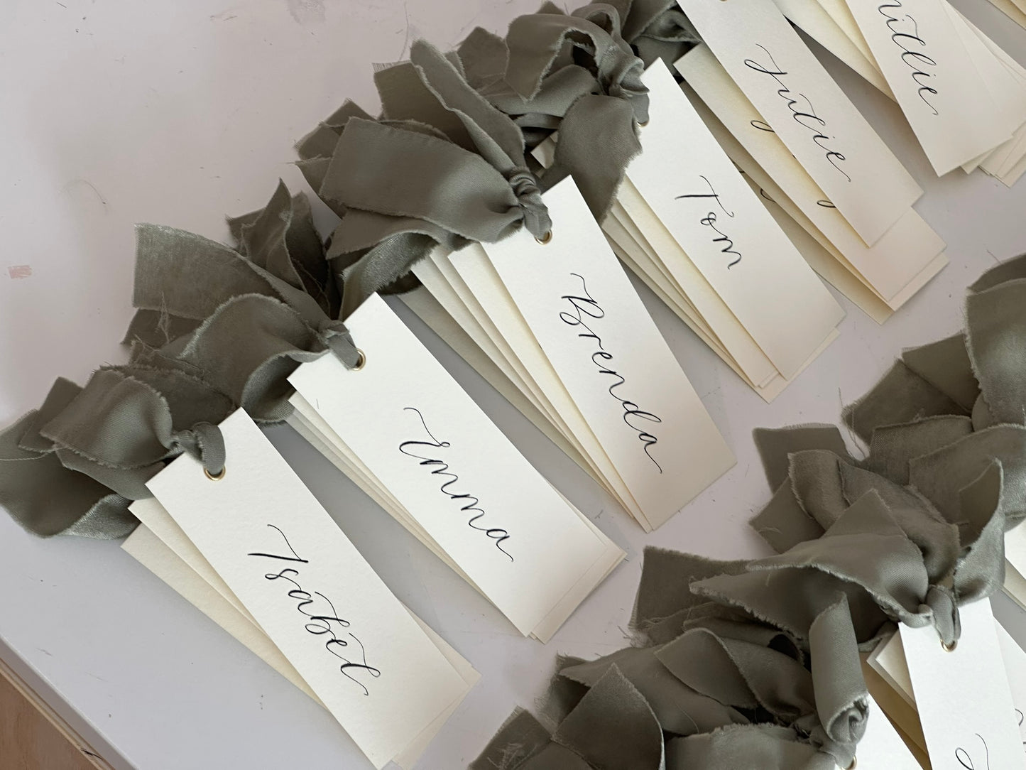 IVORY + EUCALYPTUS Green Chiffon Ribbon Calligraphy Place Name Card | Calligraphy Wedding Place Name Card | Gold or Silver Eyelet
