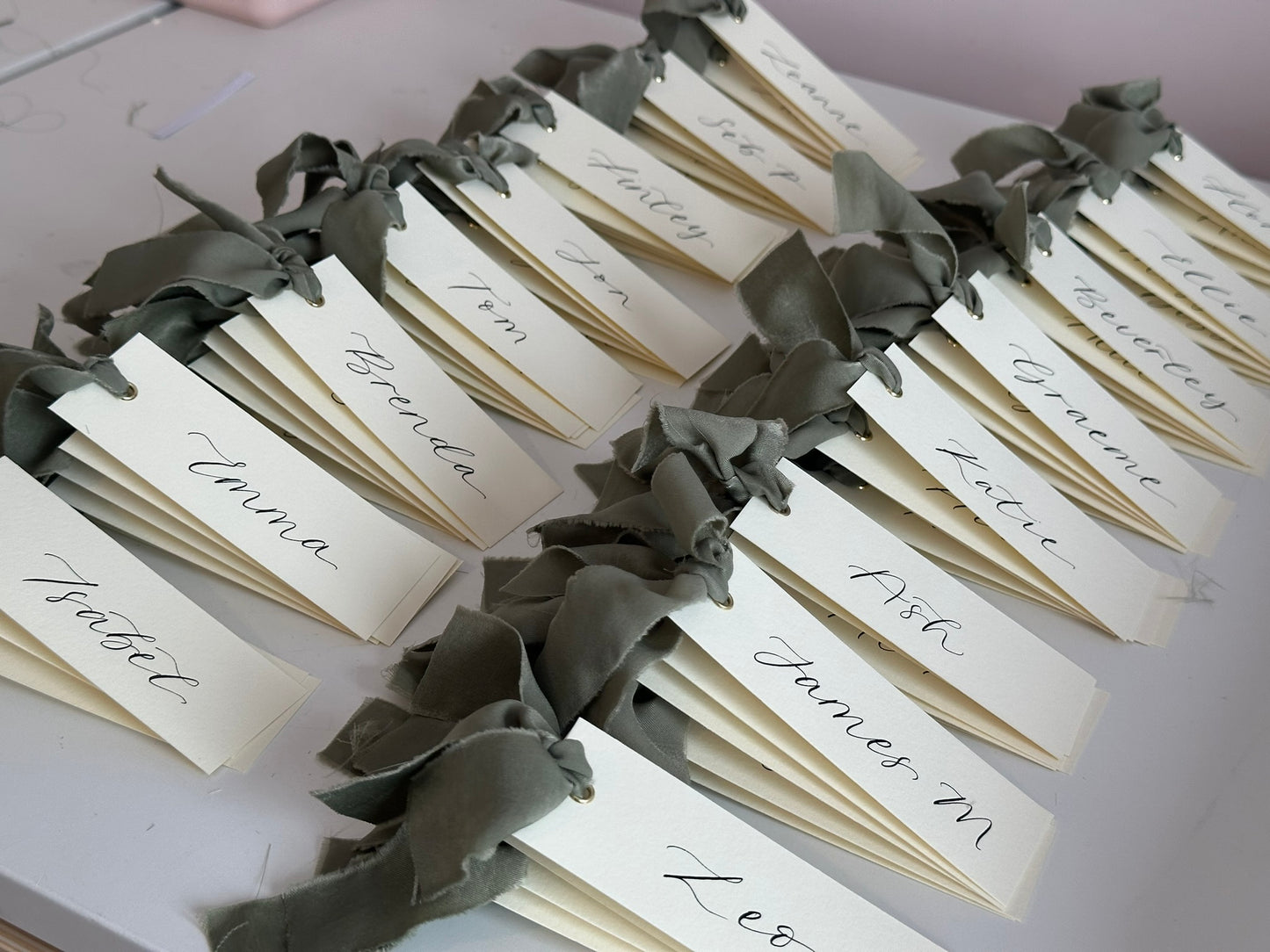 IVORY + EUCALYPTUS Green Chiffon Ribbon Calligraphy Place Name Card | Calligraphy Wedding Place Name Card | Gold or Silver Eyelet