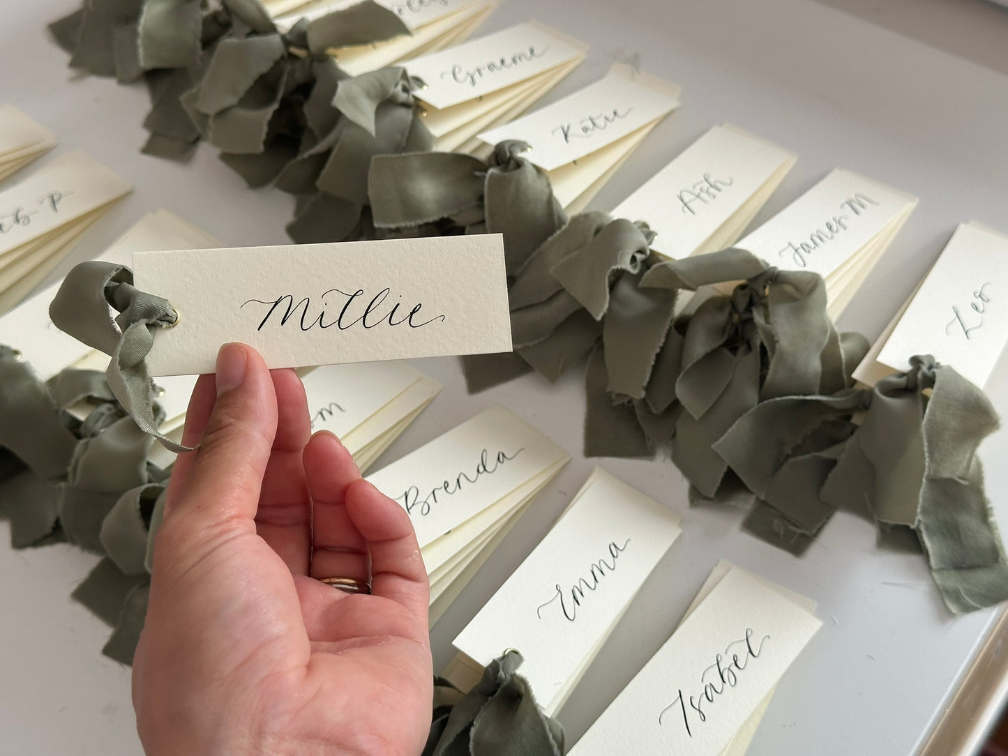 IVORY + EUCALYPTUS Green Chiffon Ribbon Calligraphy Place Name Card | Calligraphy Wedding Place Name Card | Gold or Silver Eyelet