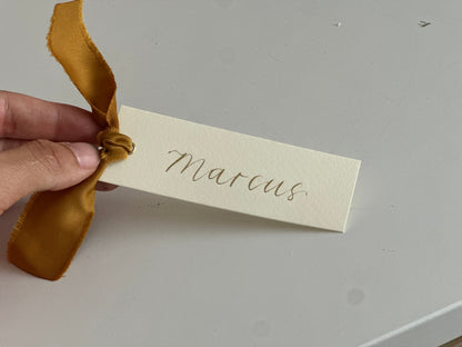 IVORY + GOLD Satin Ribbon Calligraphy Place Name Card | Calligraphy Wedding Place Name Card | Gold or Silver Eyelet