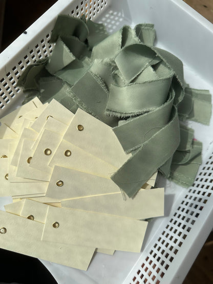 Blank place cards with sage satin ribbon and eyelet