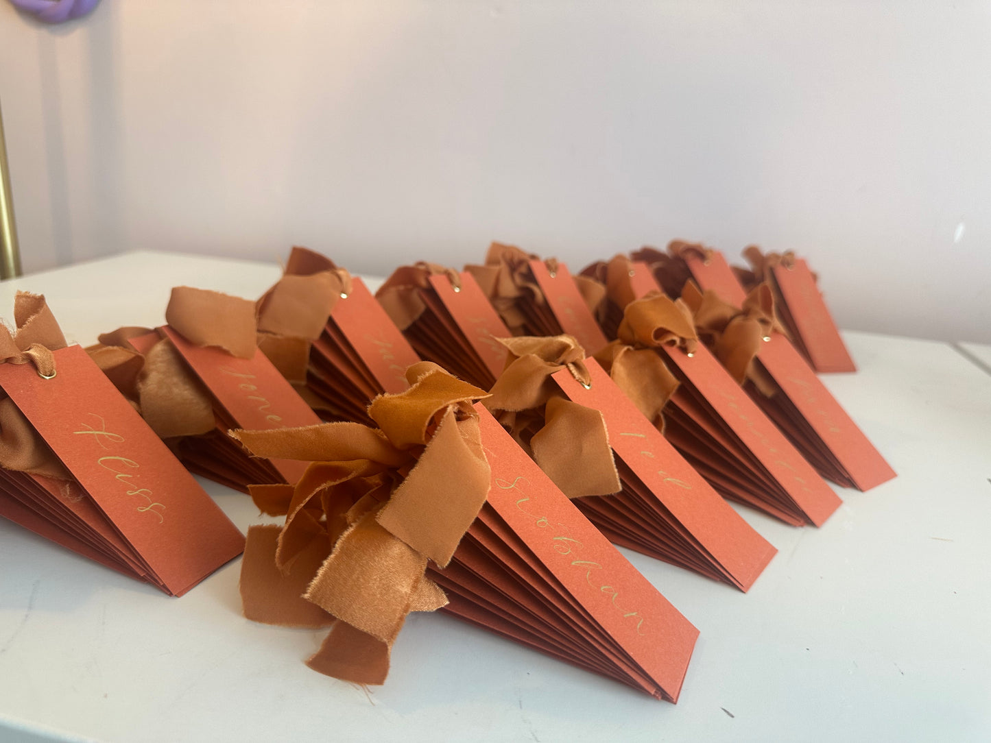 Ochre Chiffon Wedding Place Cards with Ribbon | Orange Calligraphy Place Cards