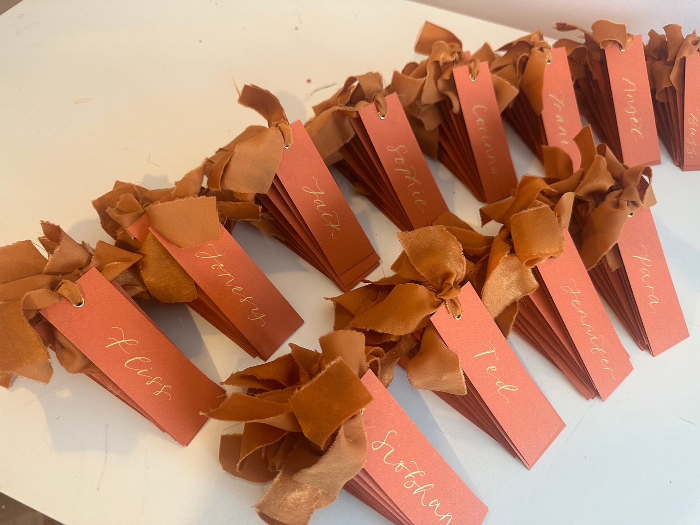 Ochre Chiffon Wedding Place Cards with Ribbon | Orange Calligraphy Place Cards