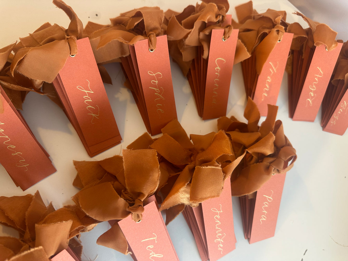 Ochre Chiffon Wedding Place Cards with Ribbon | Orange Calligraphy Place Cards