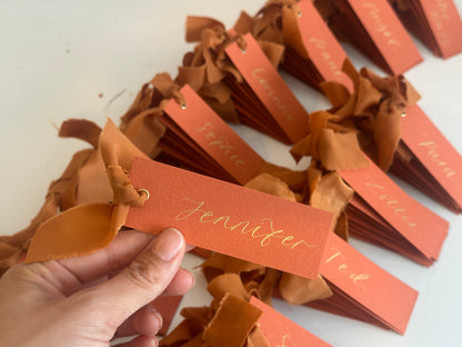 Ochre Chiffon Wedding Place Cards with Ribbon | Orange Calligraphy Place Cards