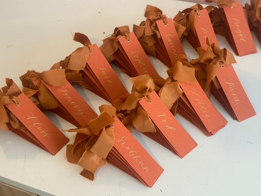 Ochre Chiffon Wedding Place Cards with Ribbon | Orange Calligraphy Place Cards
