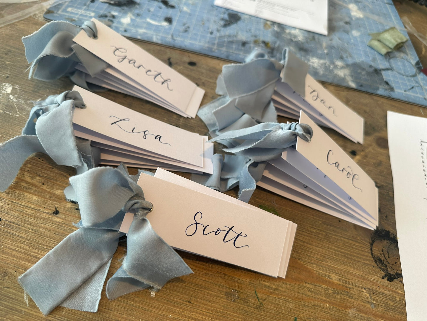 DUSKY BLUE Chiffon Ribbon Calligraphy Place Name Card | White Calligraphy Wedding Place Name Card | Gold or Silver Eyelet