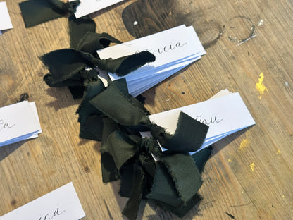 White Forest Satin Wedding Place Cards with Ribbon | Dark Green Calligraphy Place Cards