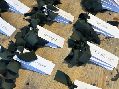White Forest Satin Wedding Place Cards with Ribbon | Dark Green Calligraphy Place Cards