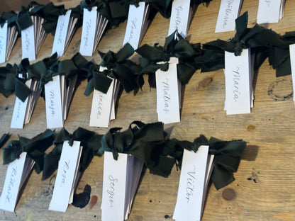 White Forest Satin Wedding Place Cards with Ribbon | Dark Green Calligraphy Place Cards