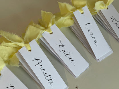 BUTTER Ribbon Calligraphy Place Name Card | White Calligraphy Wedding Place Name Card | Gold or Silver Eyelet