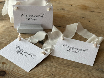 Custom Ribbon Calligraphy Wedding Reserved Chair Sign | A7 Hammered White Reserved Sign with Your Choice of Ribbon