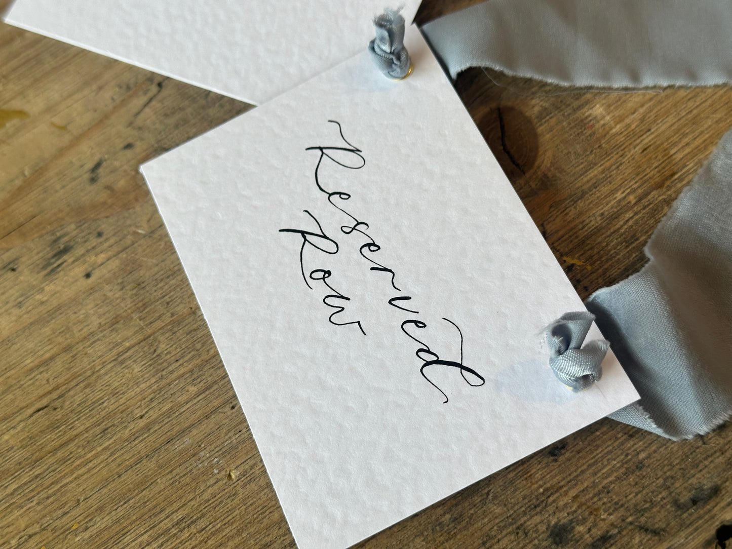 Custom Ribbon Calligraphy Wedding Reserved Chair Sign | A7 Hammered White Reserved Sign with Your Choice of Ribbon