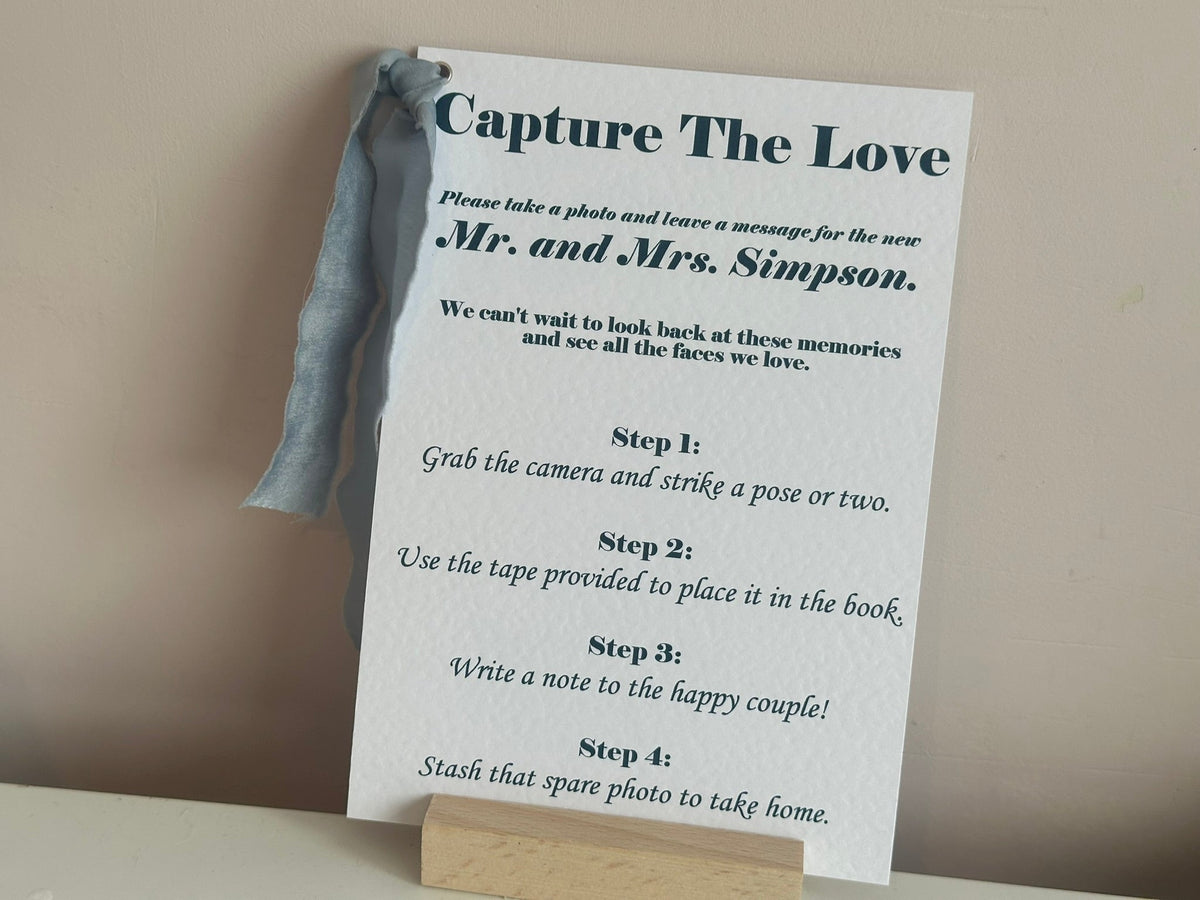 Personalised printed wedding sign on A5 hammered white card with dusky blue chiffon ribbon and silver eyelet