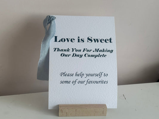 Personalised printed wedding sign on A5 hammered white card with dusky blue chiffon ribbon and silver eyelet