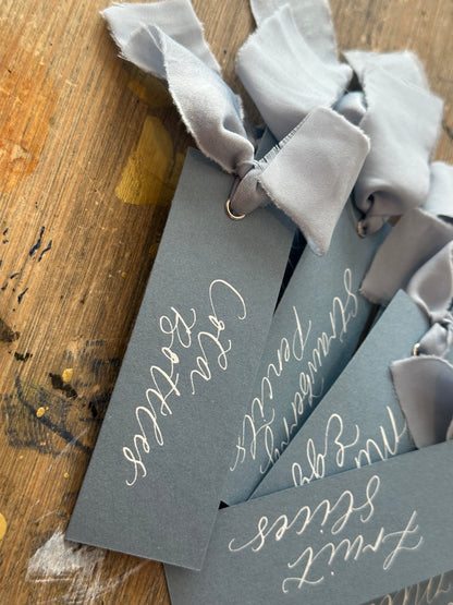 Personalised calligraphy sweet table food labels with dusky blue chiffon ribbon