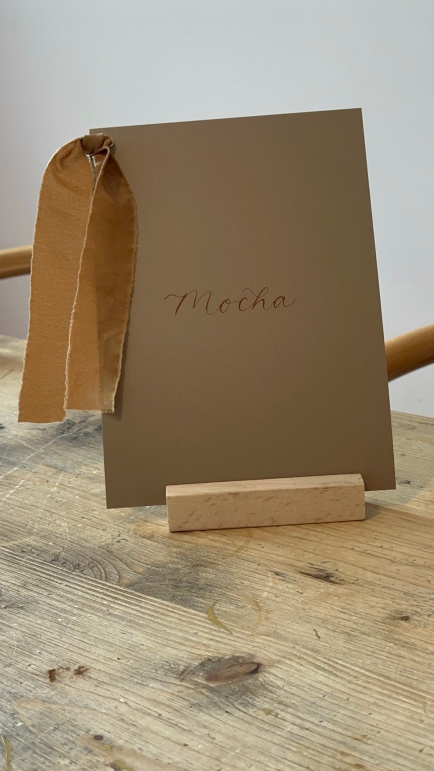 Mocha wedding table name sign with mocha ribbon and calligraphy