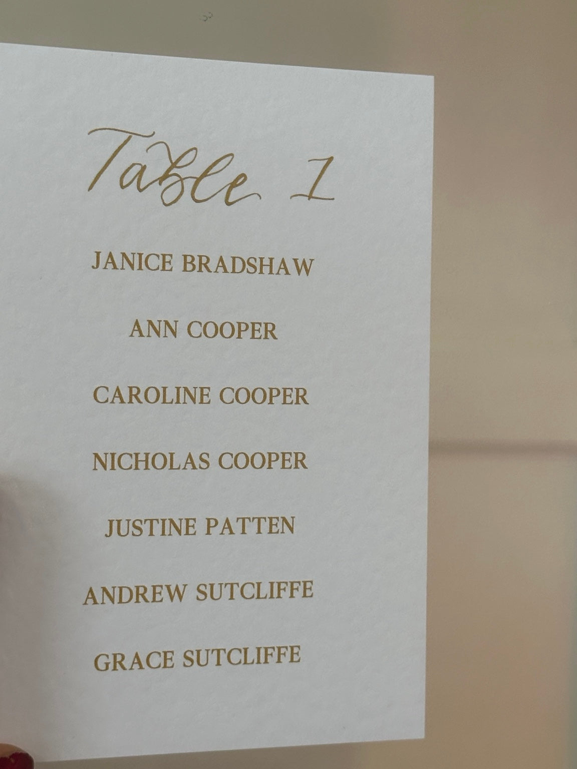 Table plan cards with handwritten Table 1 heading and printed guest names