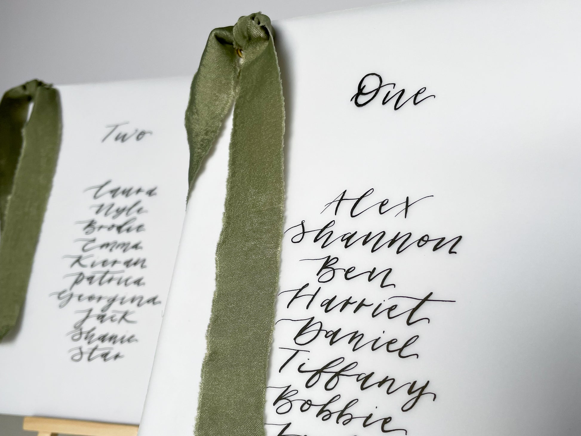 vellum Table plan card with chiffon ribbon , modern calligraphy, calligraphy table plan, vellum table plan, handwritten table plan card, modern table plan, traditional table plan, modern wedding decor, chiffon table plan, ribbon table plan, eucalyptus, sage, green, forest green, 