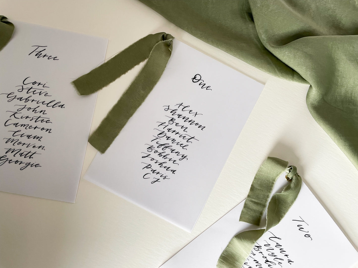 vellum Table plan card with chiffon ribbon , modern calligraphy, calligraphy table plan, vellum table plan, handwritten table plan card, modern table plan, traditional table plan, modern wedding decor, chiffon table plan, ribbon table plan, eucalyptus, sage, green, forest green, 