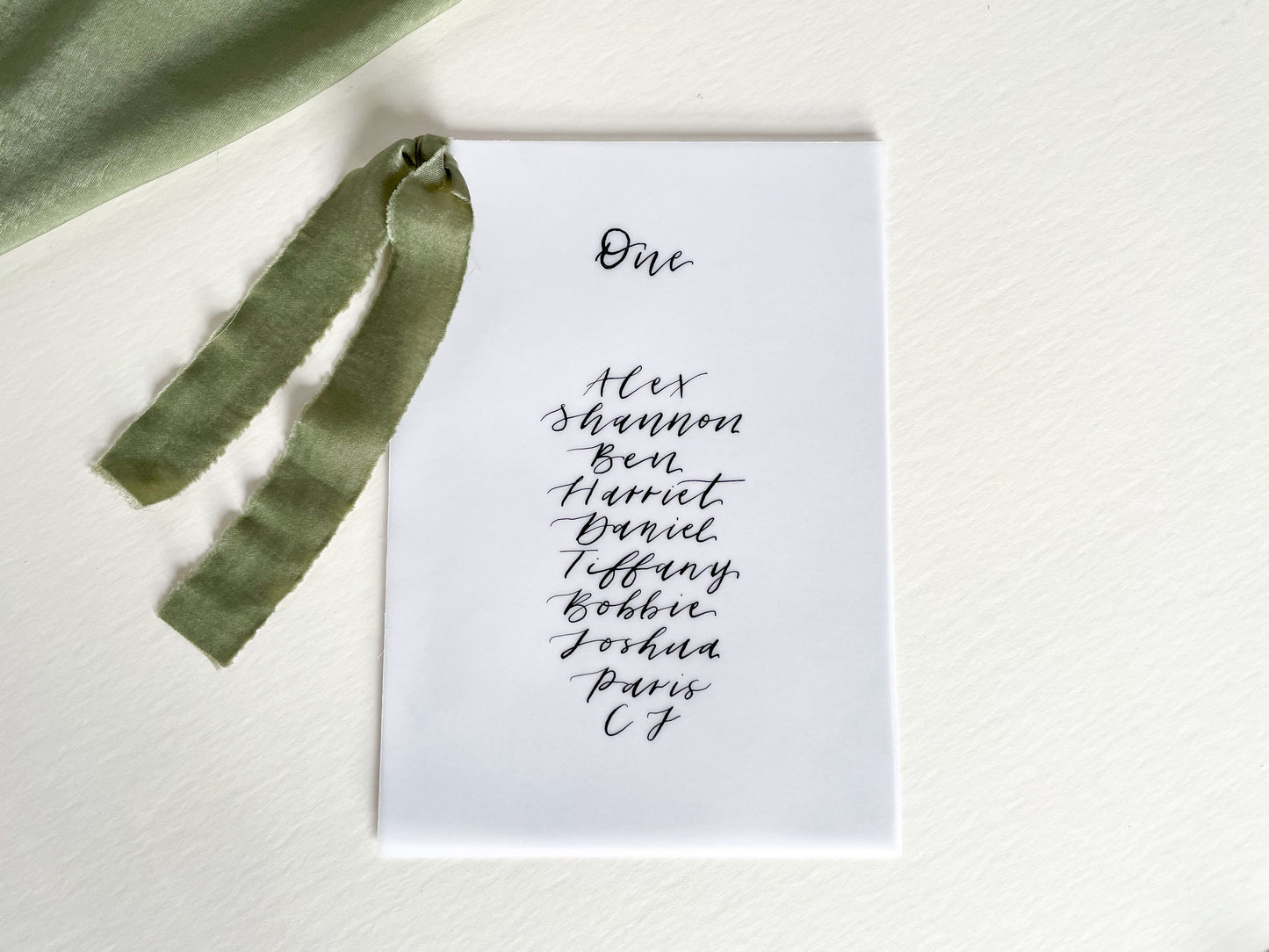 vellum Table plan card with chiffon ribbon , modern calligraphy, calligraphy table plan, vellum table plan, handwritten table plan card, modern table plan, traditional table plan, modern wedding decor, chiffon table plan, ribbon table plan, eucalyptus, sage, green, forest green, 