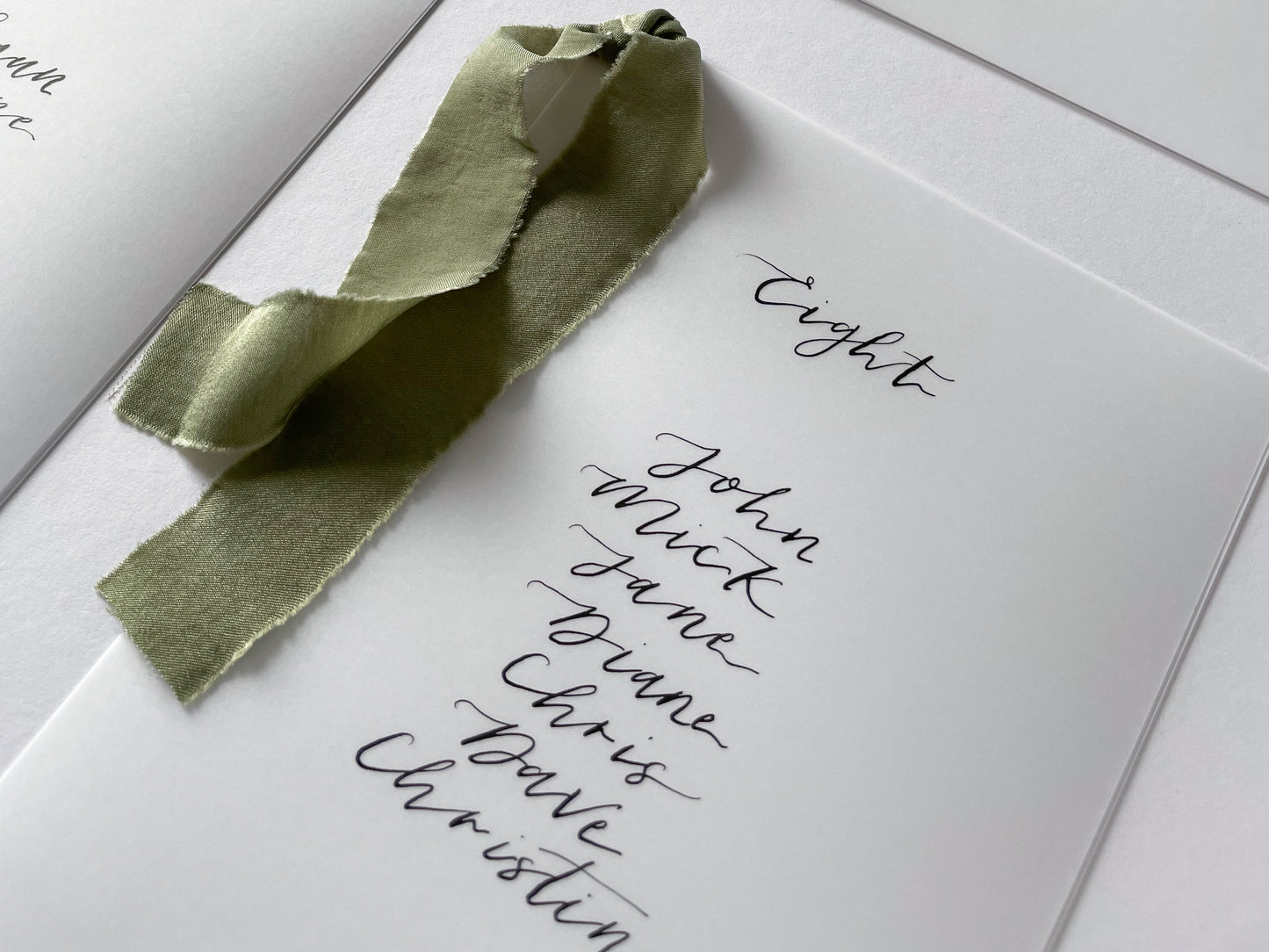 vellum Table plan card with chiffon ribbon , modern calligraphy, calligraphy table plan, vellum table plan, handwritten table plan card, modern table plan, traditional table plan, modern wedding decor, chiffon table plan, ribbon table plan, eucalyptus, sage, green, forest green, 