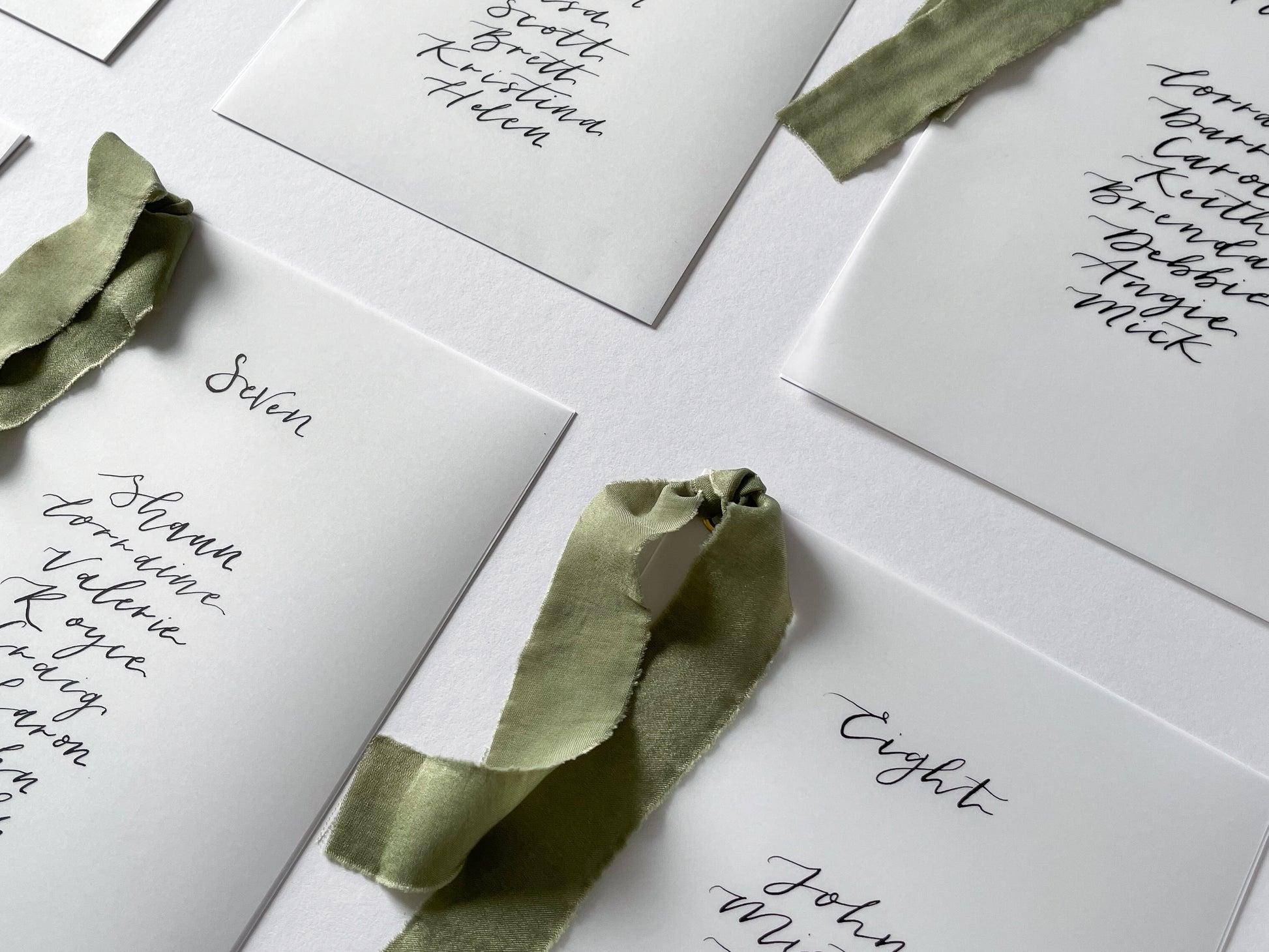 vellum Table plan card with chiffon ribbon , modern calligraphy, calligraphy table plan, vellum table plan, handwritten table plan card, modern table plan, traditional table plan, modern wedding decor, chiffon table plan, ribbon table plan, eucalyptus, sage, green, forest green, 